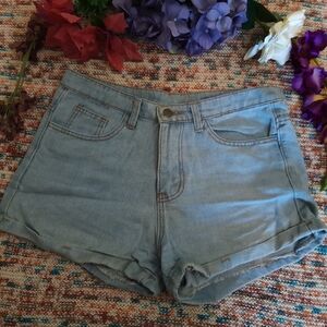 Light blue denim shorts with light brown stitching, size M